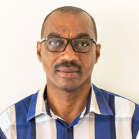 Dr. Gregory Afra Komlaga